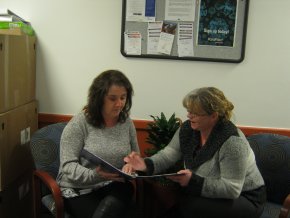 Tina Brash (right) discusses a care plan with Laurie Thompson