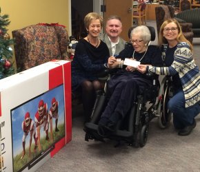 Family council co-chair Eda McAvoy and our Administrator Sean Weylie presenting a cheque to the winner.