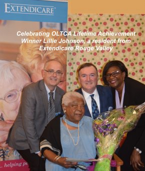 Lillie Johnson (sitting down) with Michael Harris, VP-Operations, Tim Lukenda, President & CEO and Terry Pilgrim, Administrator of Extendicare Rouge Valley