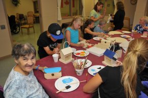 During P.D school days, staff are invited to bring their children into work for fun and interaction with the residents.